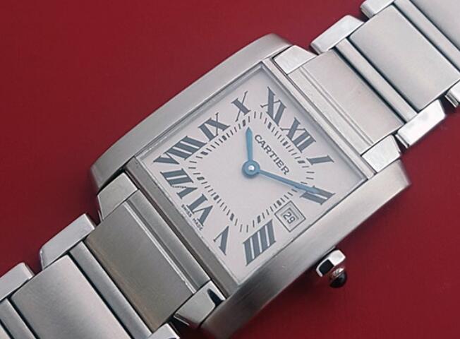 The blue hands and black hour markers are striking on the silver dial.