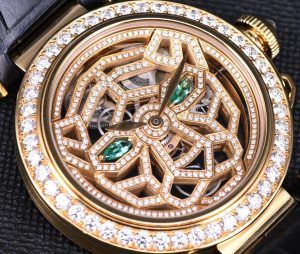 The 18k gold fake watch is decorated with diamonds.